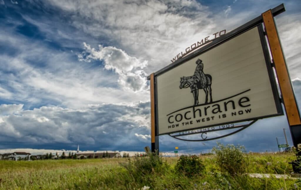 Welcome to Cochrane sign under cloudy sky